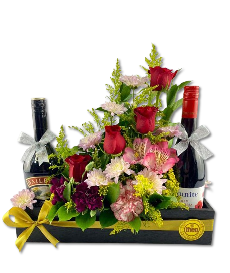 Arreglo de flores con vino bello